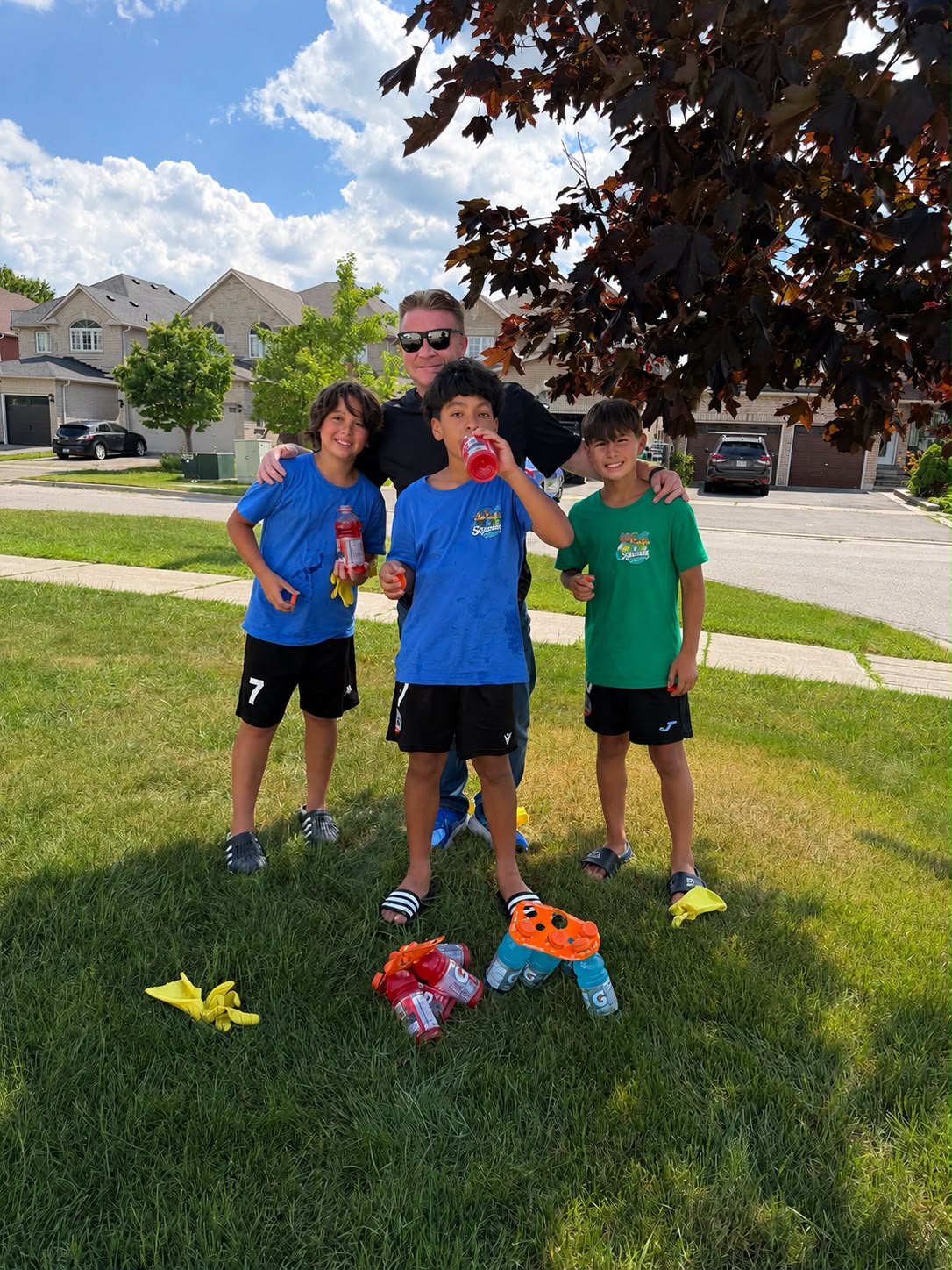John with young soccer players in the neighbourhood